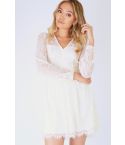 Danity Cream Long Sleeved Dress With Sheer Lace Back And Sleeves