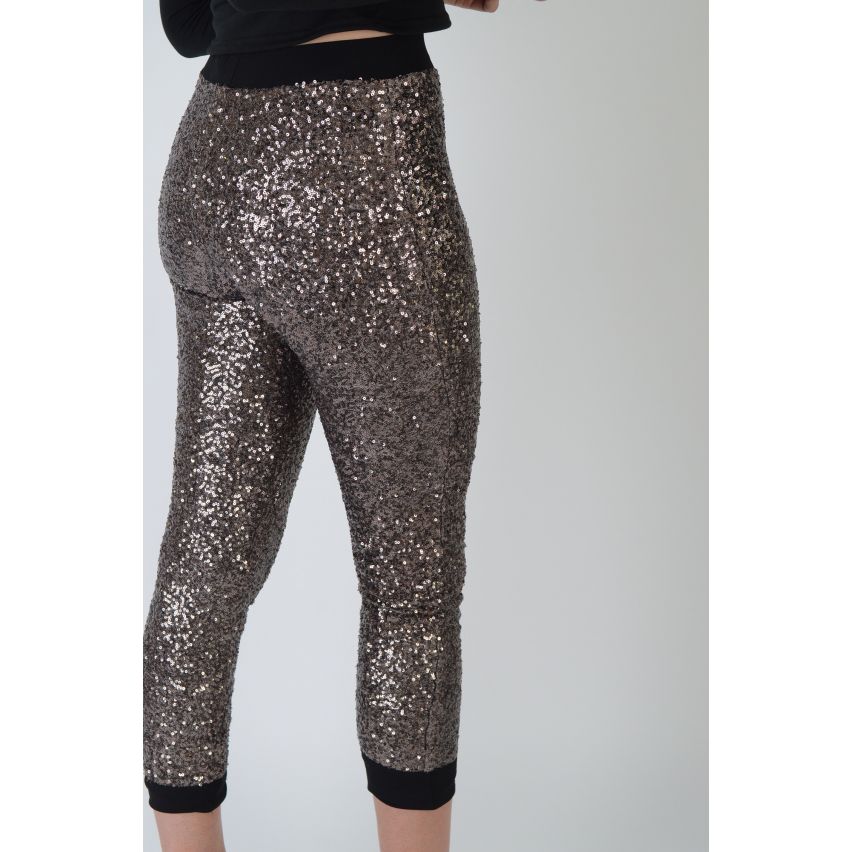 Leggings de lentejuelas de oro Lovemystyle con pretina negra - muestra